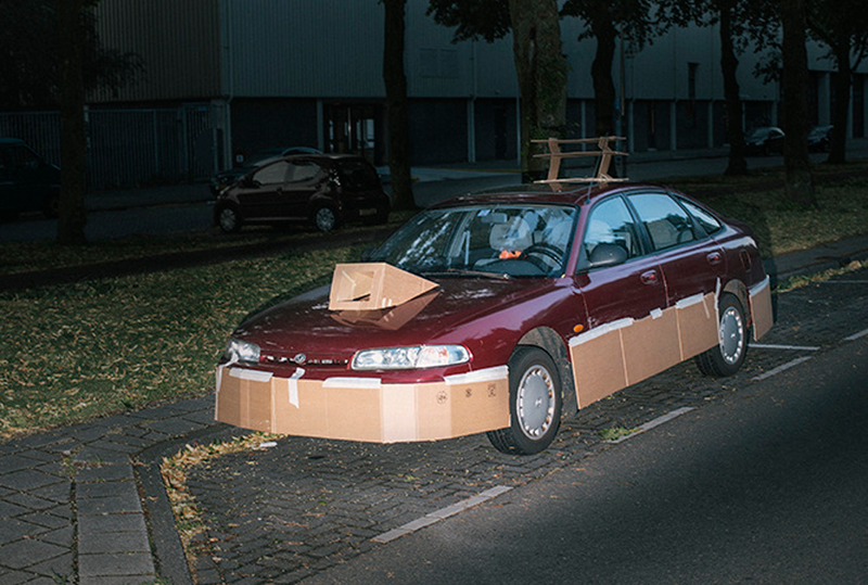 Illustration for article titled This Artist Turns Boring Rides Into Supercars At Night Using Cardboard